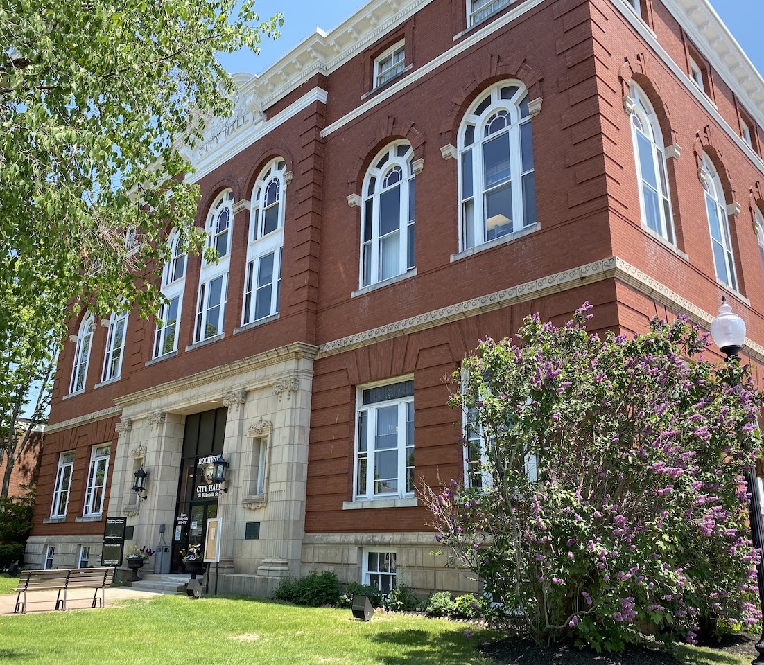 Rochester City Hall beside blooming lilacs